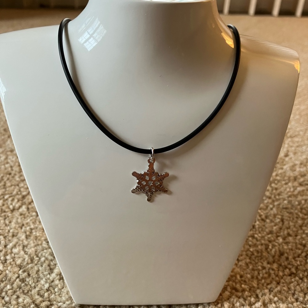 16” black synthetic necklace with 3 silver charms